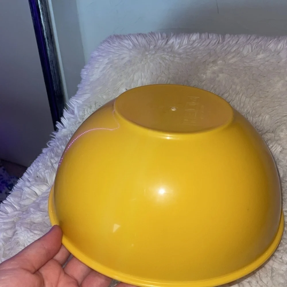 Yellow  bowl not new but never used just stored away made of plastic